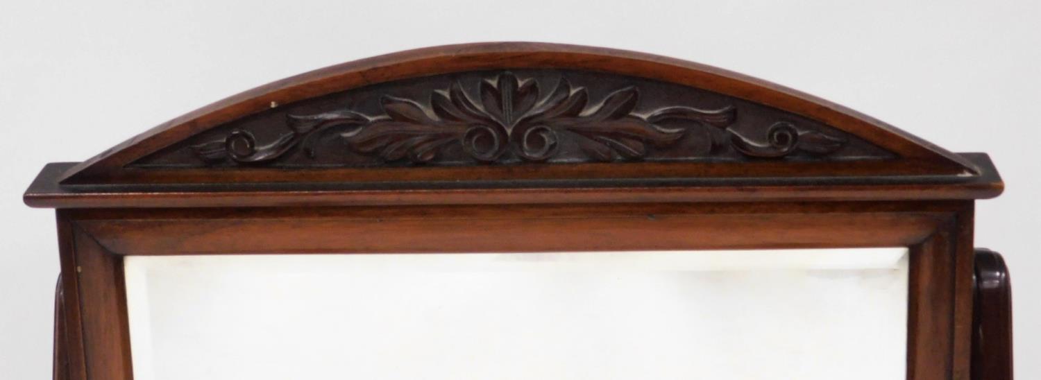 An early 19thC mahogany cheval mirror, of rectangular form with a scroll carved fret, on a turned - Image 2 of 2