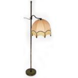 A metal framed adjustable standard lamp, with plain cylindrical stem on circular foot, with peach