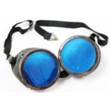 A pair of vintage airman's goggles, set with blue glass with elasticated straps, each eye piece, 5cm