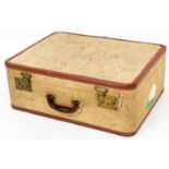 A vintage pressed cream leather finish travel case, with brass lock and brown leather extremities