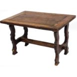 A 20thC oak coffee table, with rectangular top, on shaped legs joined by a H stretcher, 47cm high,