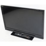 A Toshiba Regza 44 inch television, in black trim with remote controls and cable, 42AV635D.