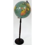An early 20thC terrestrial globe on stand, the paper moulded globe, on steel apex, on a turned