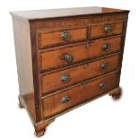 An early 19thC oak and marquetry chest, of two short and three long drawers, each drawer with