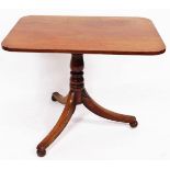 A 19thC mahogany tilt top occasional table, the oblong top raised on a baluster stem terminating