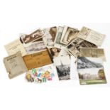 A small group of black and white postcards and stamps, comprising Dartmoor, Catacombe, Oxford,