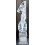 A concrete garden statue formed as Venus, with shell and stepped base, set with garlands, 153cm