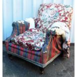 A late Victorian armchair, with upholstered back and seat in later stripe material with a Howard
