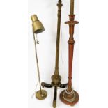 Three standard lamps, comprising a gilt rams head standard lamp, a gilt and red swan neck standard