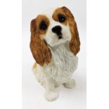 A Sandycast Cavalier King Charles dog, 34cm high.N.B. This lot is sold on behalf of the Rotary