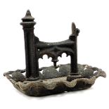 A late 19thC cast iron boot scraper, with graduated 'H' shaped centre, on a pierced stand, 35cm