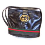 A Gucci vintage ladies handbag, in brown leather, with a red and green band, and fold over clasp