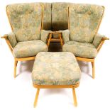 A lightwood Ercol cottage suite, comprising two seater settee, 144cm wide, and two armchairs, each