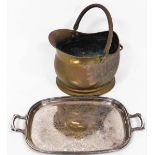 A copper coal helmet, and a silver plated serving tray. (2)