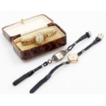 Three wristwatches, to include a silver plated marcasite watch, on two row leather strap, a gold