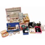 A pink jewellery box and contents, comprising wristwatches, pocket watches, poppy pendant, poppy