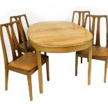 A Nathan ash and elm dining suite, comprising an oval extending dining table, and four matching