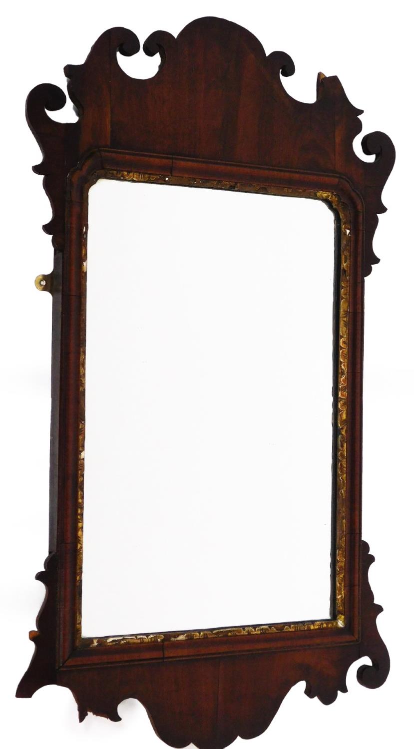 An early 19thC fret framed rectangular wall mirror, with fret carved and scroll top, with gilt