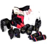 A Taekwondo kit, to include helmet, foot covers, gloves, knee pads, etc. (a quantity)