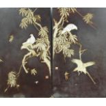A pair of Japanese wall panels, raised with exotic birds and trees, red seal marks, 92cm x 62cm.