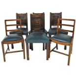 A set of late 19thC oak dining chairs, each with shield carved back, on blue faux leather seats,