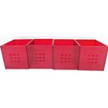 A set of four red plastic organising boxes.N.B. This lot is sold on behalf of the Rotary Club of