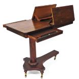 An early 19thC rosewood reading table, the oblong top with a bead outline with articulated