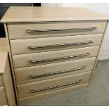 A modern chest of five drawers, with three shallow and two deep drawers, with wood finish, and