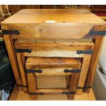 A nest of three hardwood side tables, each with brass bound buckle decoration sides, the largest