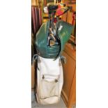 A set of golf clubs, in McGreggor leather carry bag, to include three Ping clubs, nickel putters and