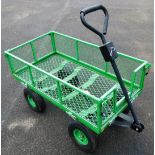 A green sack barrow trolley.