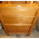 A modern oak filing drawer, comprising three drawer design, with file tray insert to bottom