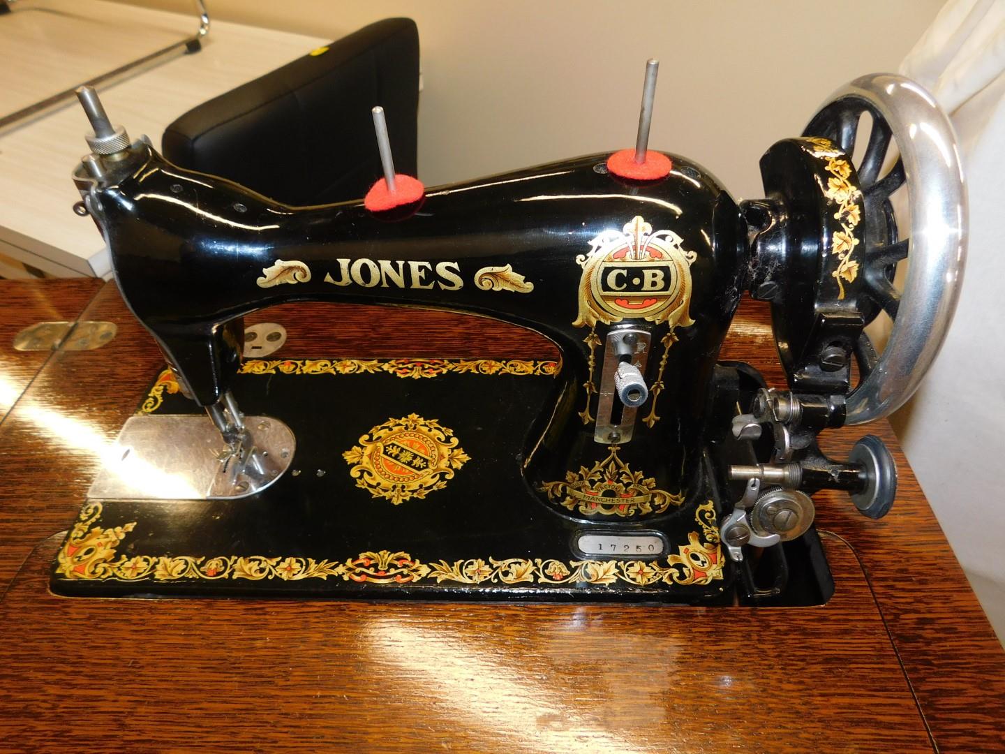 A Jones sewing machine in oak stand, enclosed in a mahogany tailors work stand, with compartment - Image 2 of 2