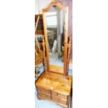 A pine framed cheval mirror, the rectangular mirror top with barleytwist supports on a chest base
