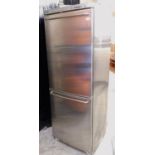 A Bosch tall fridge freezer, with two compartments, in silver.