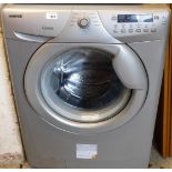 A Hoover Optima washing machine, in silver.