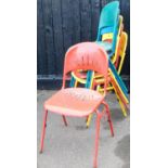 A set of six painted metal stacking chairs, with pierced backs and seats, 95cm high.