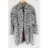 A Le Nouveau leopard print white and brown ladies full length fur coat.