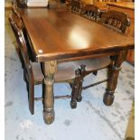 A large stained oak refectory table, the plain rectangular top above bobbin turned legs, 76cm