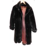 An Apparence of Paris ladies brown full length fur coat.