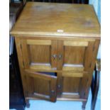 A mahogany finished TV cabinet, the enclosed top for TV, with cupboard base, on square tapering