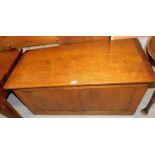 An oak blanket box, with two panel section to front and lift lid enclosing plain interior, 47cm
