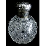 A late 19th/ early 20thC cut glass globular scent bottle, the white coloured metal hinged lid