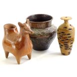 An eastern embossed copper vase, a turned wooden vase with honeycomb type effect, and a pre-