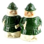 A pair of 19thC Staffordshire jars and covers, each modelled in the form of a policeman wearing a