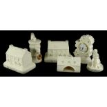 A quantity of Donegal Belleek items, to include two old Irish cottages, 18cm wide, a water pump, a