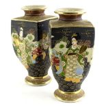 A pair of Japanese earthenware square section vases, each decorated with figures and with raised