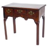 A George III mahogany lowboy, the rectangular top with a moulded edge, above three frieze drawers