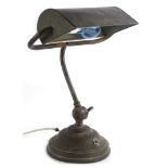 A bronzed metal reading lamp, on a domed foot, 29cm wide.