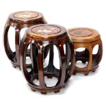 A pair of oriental hardwood and mother of pearl inlaid barrel shaped stools or low stands, 43cm